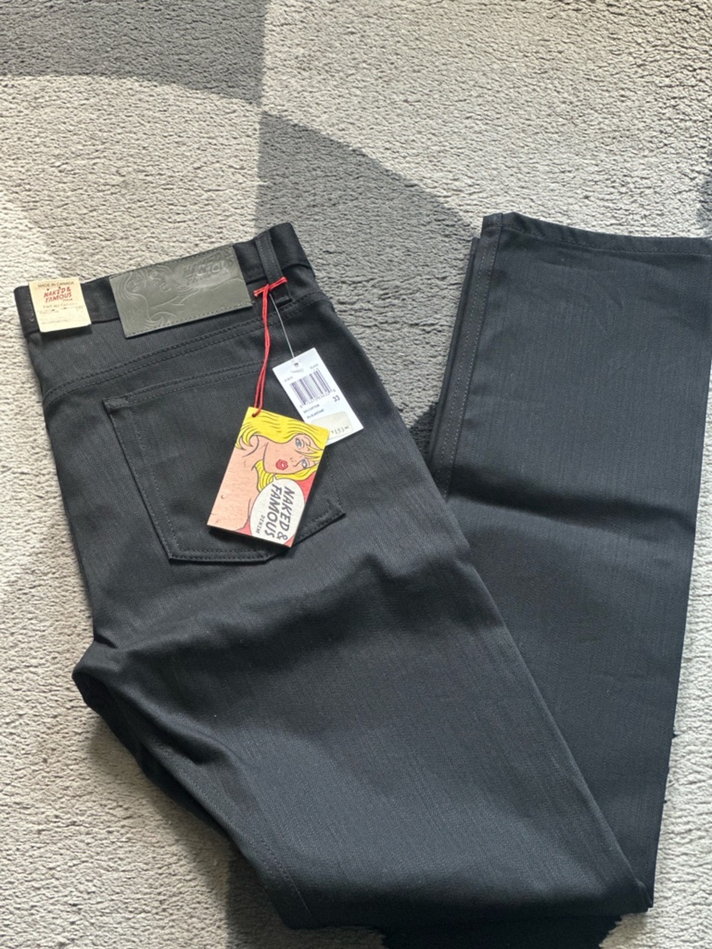 Naked & Famous Denim Black Straight-Leg Jeans with Graphic Hang Tag